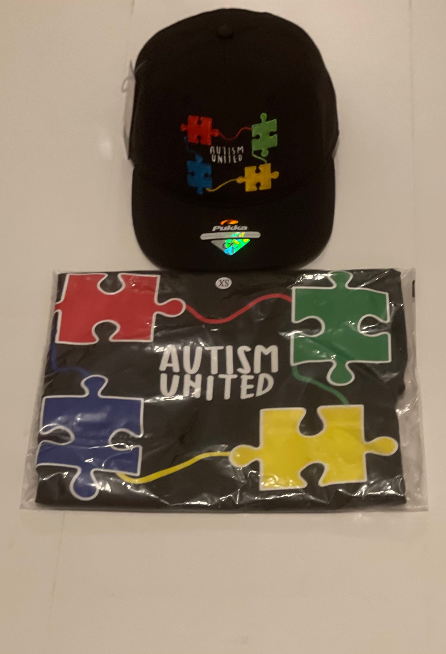 Autism United Snap Back Hat T-Shirt Sold Separately.