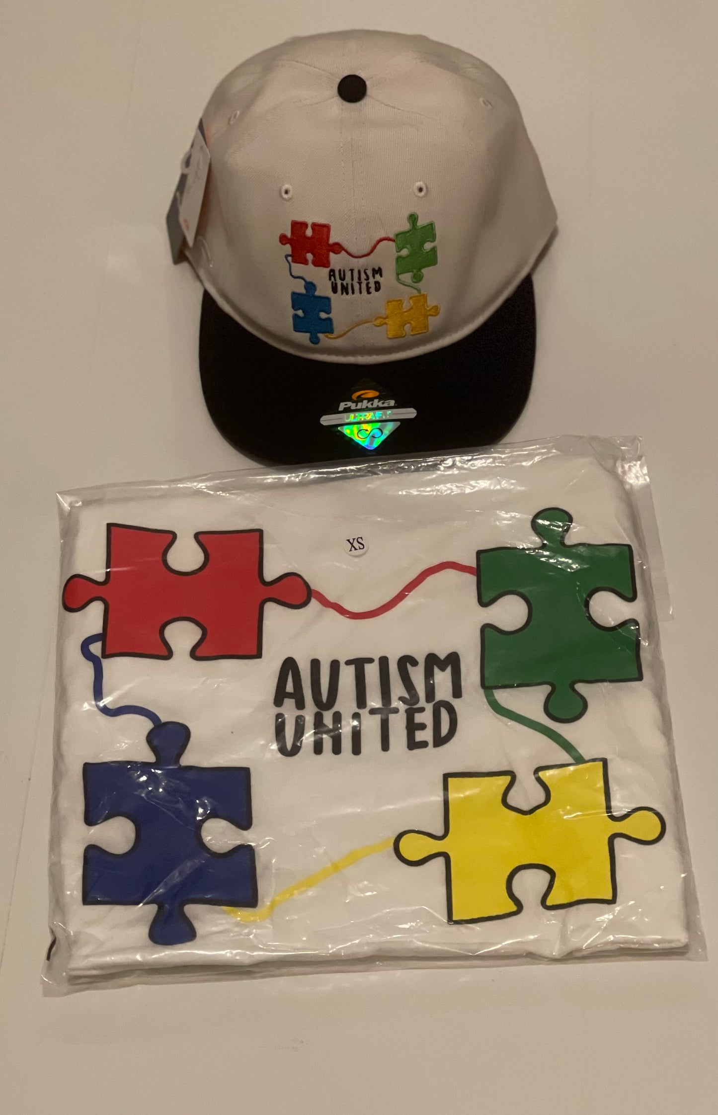 Autism United Snap Back Hat T-Shirt Sold Separately.